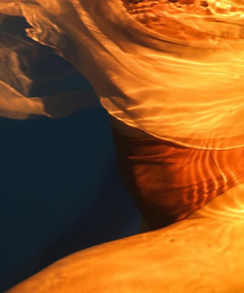 Abstract silhouette of a human body with lines showing energy flow.